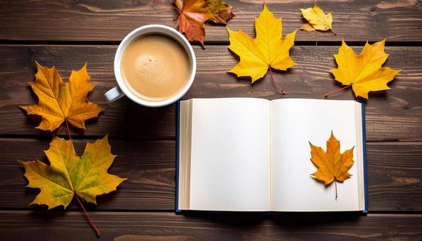 机上で開いた本とホットコーヒーと紅葉 机上で開いた本とホットコーヒーと紅葉の写真