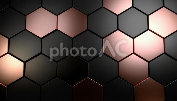 ピンクゴールドのハニカム構造　金属背景 ピンク,ゴールド,黒の写真素材
