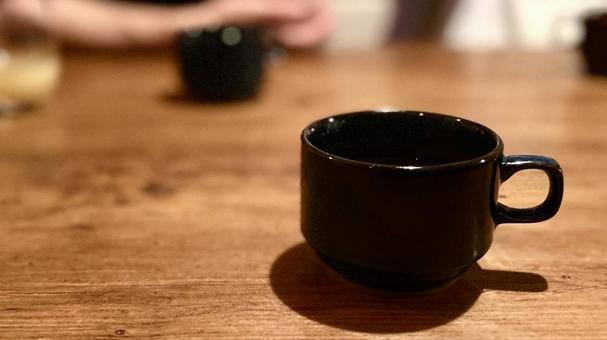 黒いコーヒーカップ 黒いコーヒーカップの写真