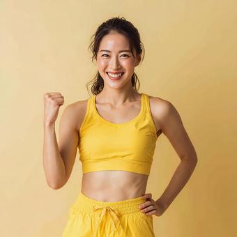 喜びを表現する、スポーツウェア姿の女性 喜びを表現する、スポーツウェア姿の女性の写真