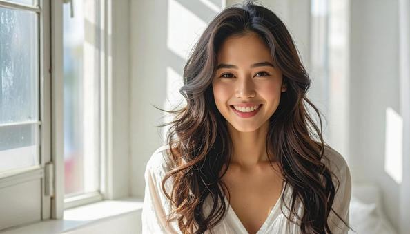 笑顔の若い女性のポートレートの写真