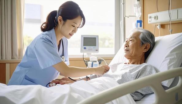 患者の血圧を測る看護師 患者の血圧を測る看護師の写真