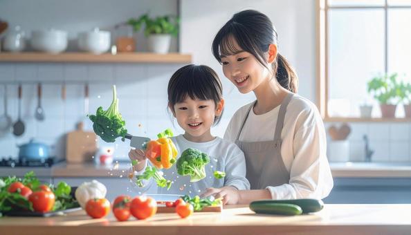 ホログラムで野菜の切り方を学ぶ親子 ホログラムで野菜の切り方を学ぶ親子の写真