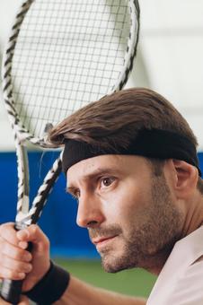 ヘッドバンドを着けた男性テニス選手 男性,外国人,テニスの写真素材