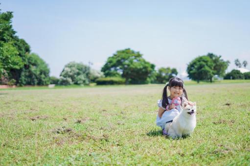 Little girl walking a dog, JPG