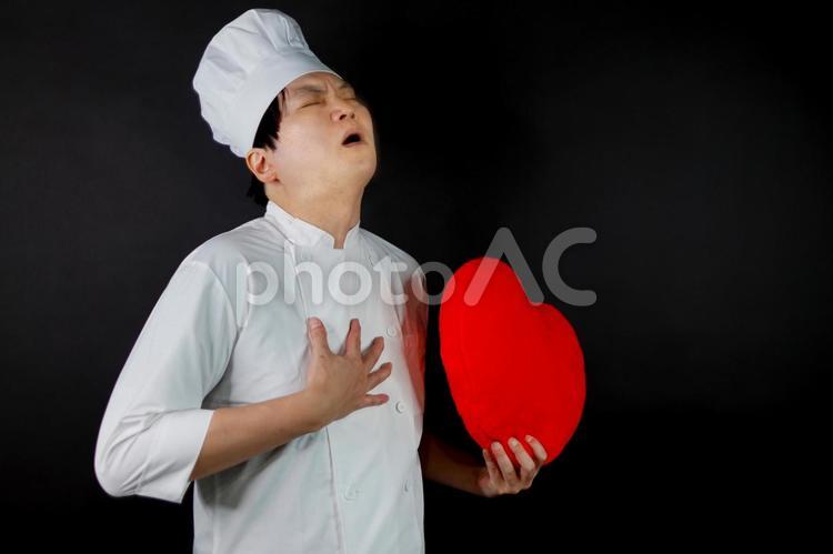 胸を押さえるシェフの苦痛 シェフ,コック帽,白衣の写真素材