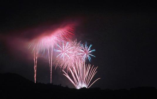 Large mountainside fireworks hidden by clouds, JPG