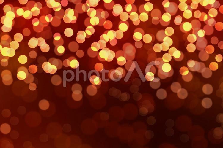 クリスマスや新年のイメージに‐キラキラ光るイメージ背景 レッド,赤,光の写真素材