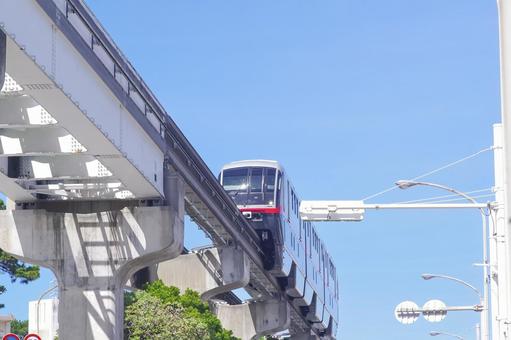 Okinawa Monorail train running under clear skies, JPG Okinawa Monorail train running under clear skies, JPG