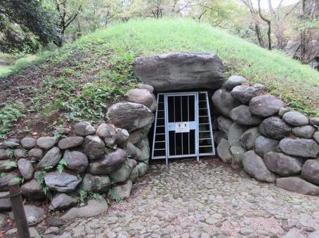 Entrance of old burial mound, ancient tomb, a circular mound, remains, JPG