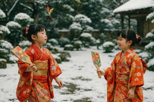 羽子板で遊ぶ子どもの写真