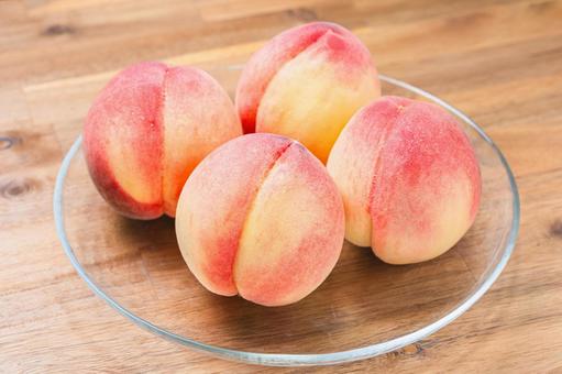 Peaches served on a glass plate (wood grain background), JPG Peaches served on a glass plate (wood grain background), JPG
