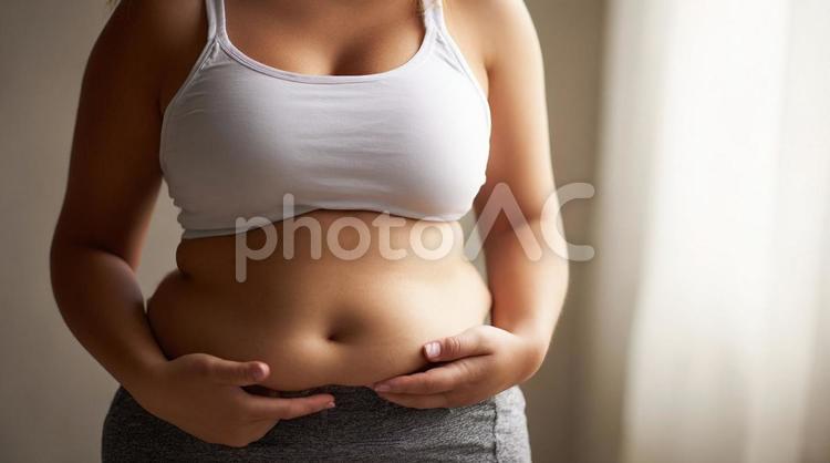 お腹のたるみが気になる女性 ダイエット,女性,お腹の写真素材