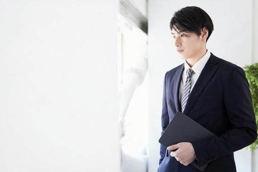 Japanese male businessman looking out the window with a serious expression, JPG Japanese male businessman looking out the window with a serious expression, business, male, businessman, JPG