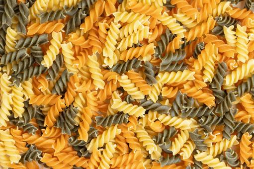 Three-colored fusilli laid out, JPG Three-colored fusilli laid out, JPG