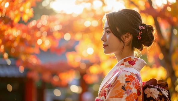 紅葉を眺める晴れ着姿の女性のポートレートの写真