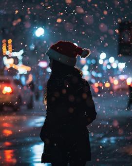 クリスマス サンタ帽子 女性 雪 夜 クリスマス サンタ帽子 女性 雪 夜の写真