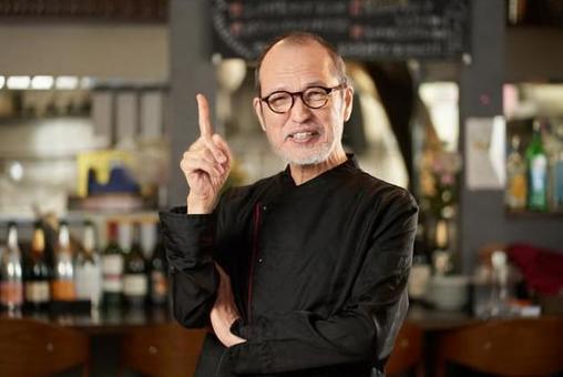 Asian man pointing at a restaurant Asian man pointing at a restaurant