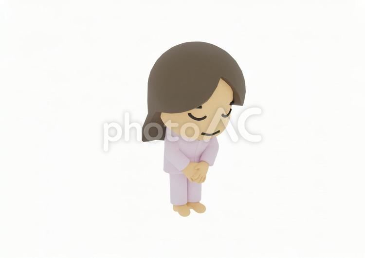 頭を下げてお辞儀するパジャマ若い女性患者 介護,入院,病気の写真素材