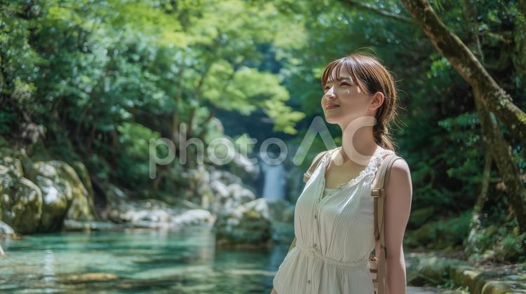 夏の深緑と清流と若い女性 女性,自然,滝の写真素材