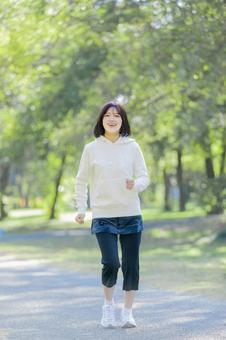 ランニング ジョギング ランニング ジョギング 学生,女性,人物の写真素材