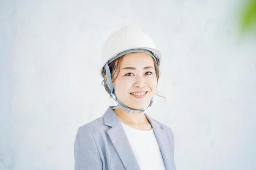 A woman in a suit wearing a helmet, женщина, деловая женщина, шлем, JPG