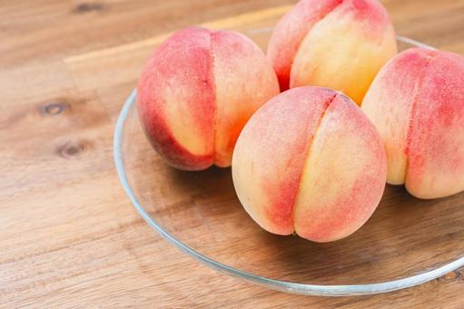 Peaches served on a glass plate (wood grain background), JPG Peaches served on a glass plate (wood grain background), JPG