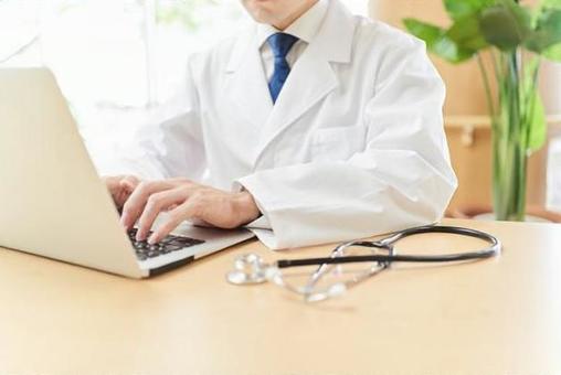 Male doctor looking up information on a computer, a doctor, doctor, information, JPG