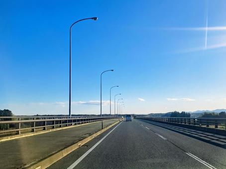 スカイロード 道路,空,街灯の写真素材