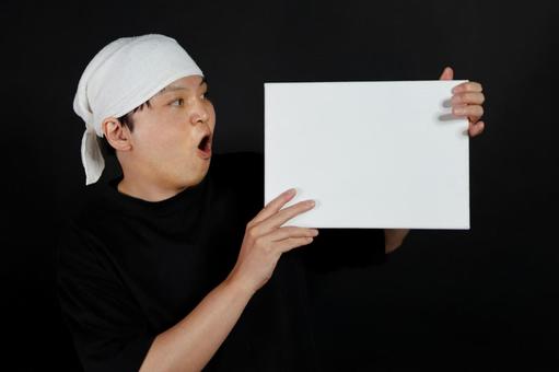 驚く男性と白いボード 驚く男性と白いボード 男性,驚き,表情の写真素材