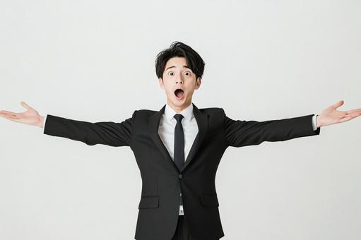 A man in a suit expressing surprise with his arms outstretched, surprise, businessman, male, JPG