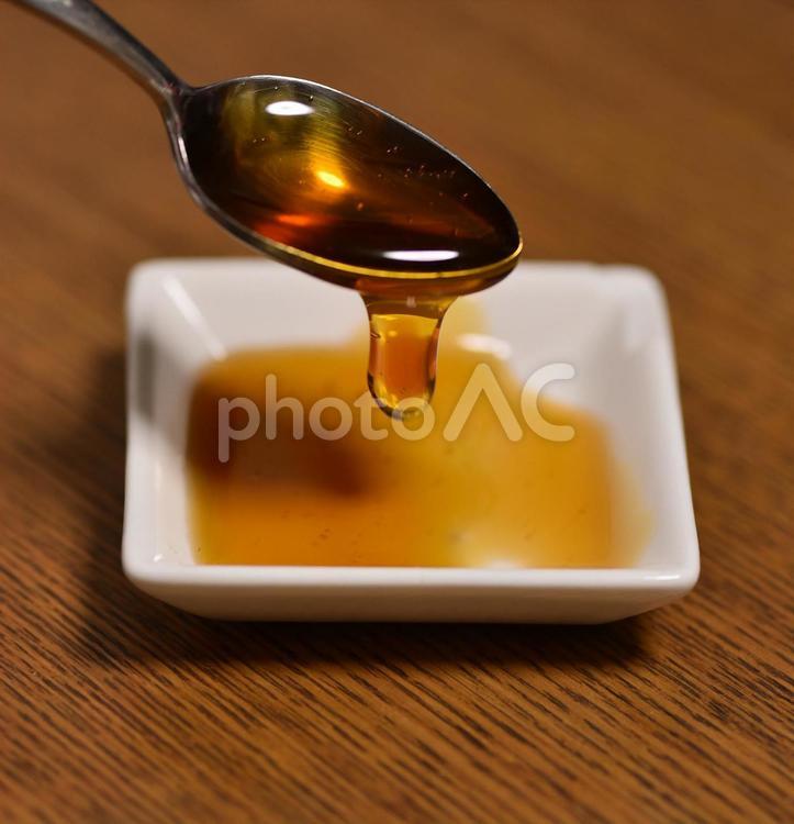 スプーンから滴るはちみつ04 honey,はちみつ,スプーンの写真素材