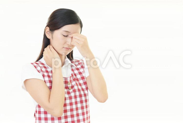 エプロン姿の女性　体調不良 女性,主婦,病気の写真素材