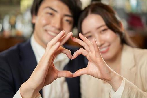 Asian couple making a heart symbol with their fingers, heart, heart mark, hand, JPG