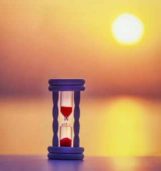 朝陽と砂時計1 コンセプト,砂時計,ひらめきの写真素材