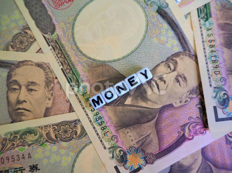 一万円札とMONEYの文字1 返済,お金,一万円の写真素材