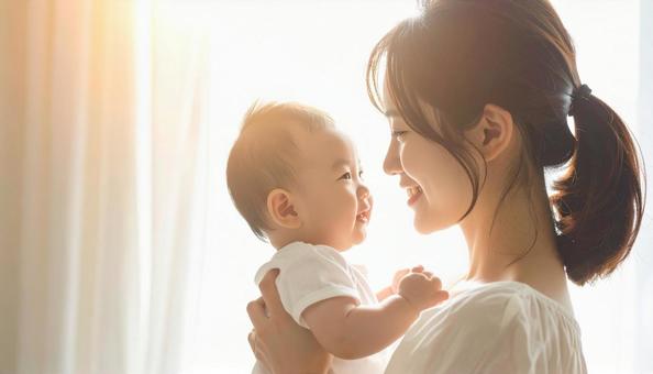 見つめ合う母親と赤ちゃん 見つめ合う母親と赤ちゃんの写真