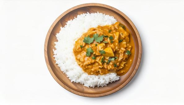 木製プレートに盛り付けられたカレーライス 木製プレートに盛り付けられたカレーライスの写真
