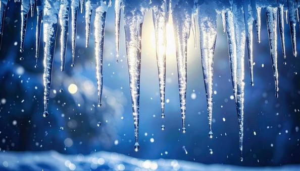 光に照らされた氷のつららと雪景色 光に照らされた氷のつららと雪景色の写真