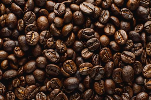 深煎りコーヒー豆が敷き詰められた背景素材 深煎りコーヒー豆が敷き詰められた背景素材 コーヒー豆,焙煎豆,深煎りの写真素材
