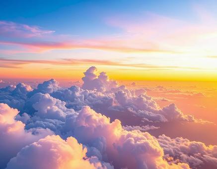 飛行機の窓から見える雲海と夕焼け 飛行機の窓から見える雲海と夕焼けの写真