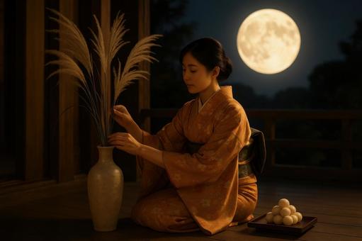 ススキを飾る和服姿の女性 ススキを飾る和服姿の女性の写真