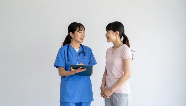 医療イメージ 打合せする若い医療関係者 医療イメージ 打合せする若い医療関係者の写真