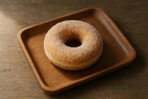 木製トレーに置かれた砂糖ドーナツ 木製トレーに置かれた砂糖ドーナツの写真