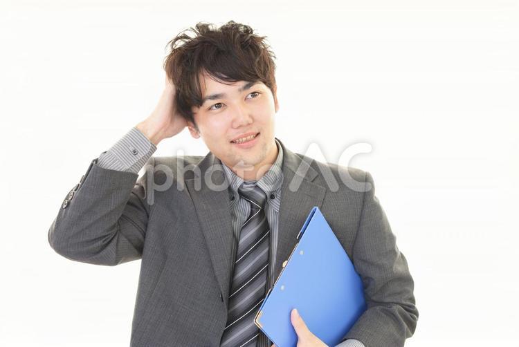 苦笑いをする男性 ビジネス,ビジネスマン,男性の写真素材