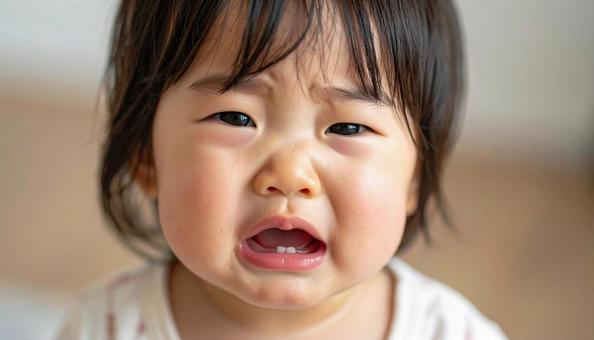 泣く日本人赤ちゃんの顔アップ 泣く日本人赤ちゃんの顔アップの写真