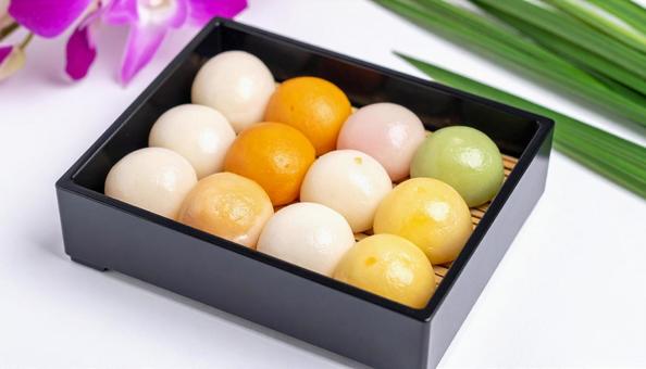 ススキと和菓子　月見団子の写真