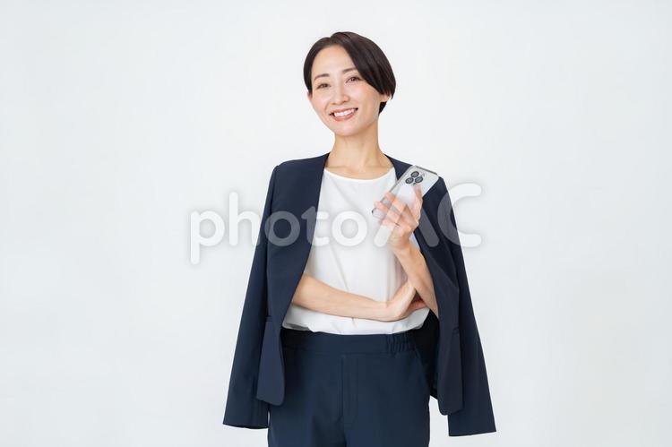 携帯を持つ女性 ビジネス,オフィス,ビジネスウーマンの写真素材