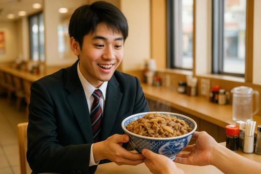 牛丼特盛を注文した学生 牛丼特盛を注文した学生の写真