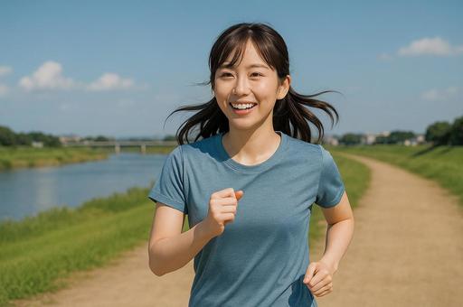 川沿いの道をランニングする女性の写真
